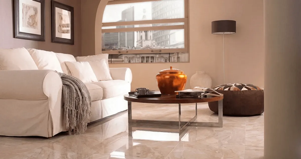 Modern living room with professionally installed marble flooring, a beige sofa, coffee table in Charleston, SC